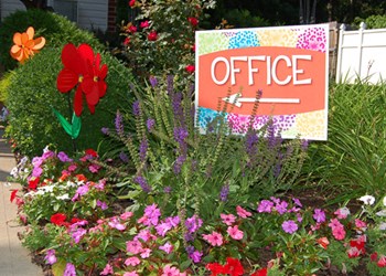 Seasonal flowers add to the charm of Mayflower Crossing Apartments.